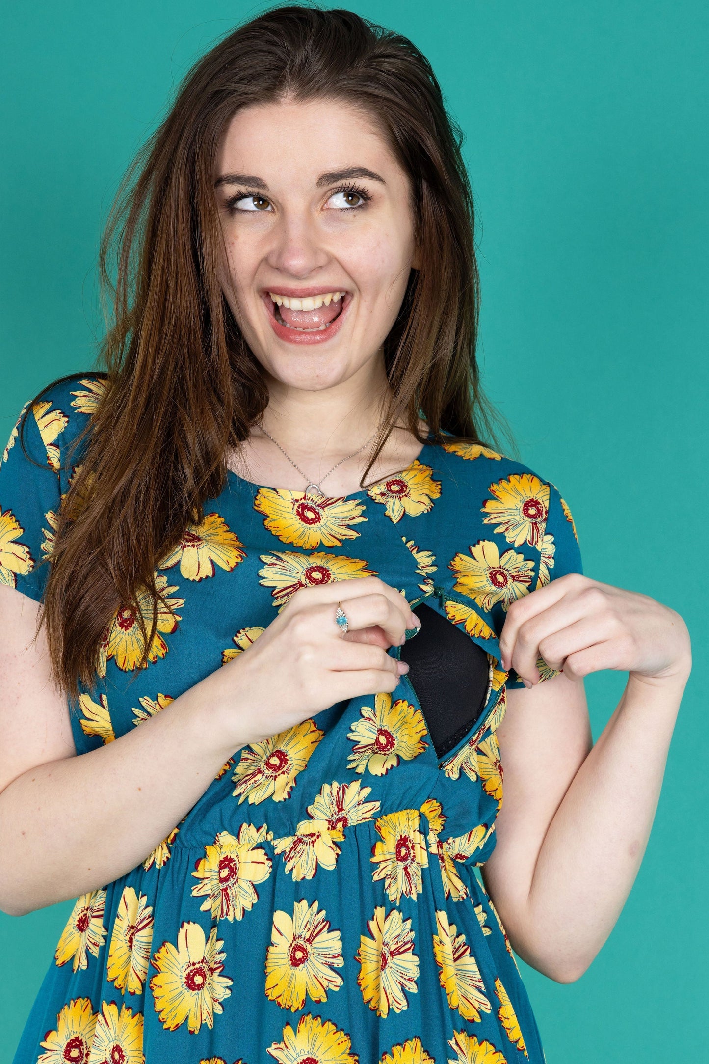 Stylish Breastfeeding Dress showing access via a zip. The dress has a sunflower print.