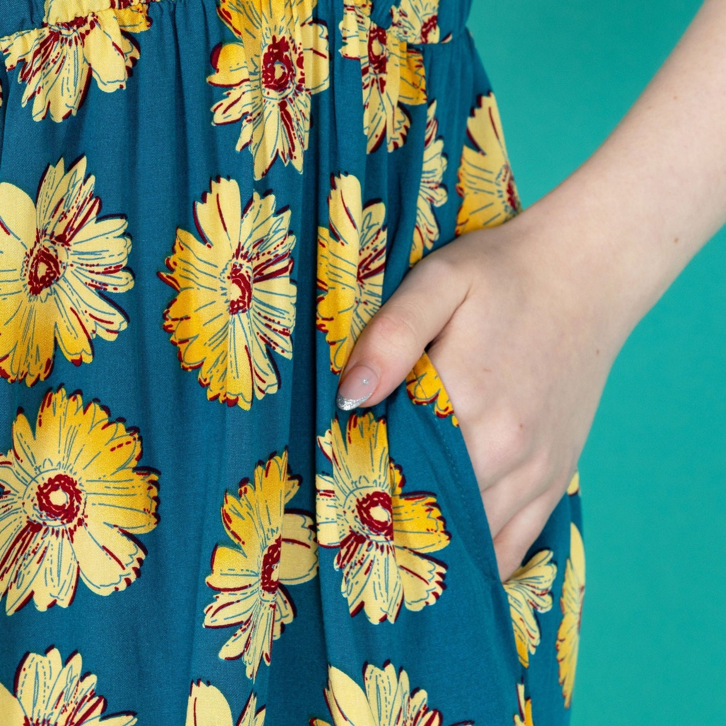 Sunflower breastfeeding dress showing a close up of the pocket.